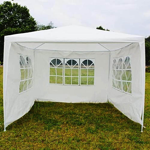 Pop up canopy tent with sidewalls providing shade at a beach event