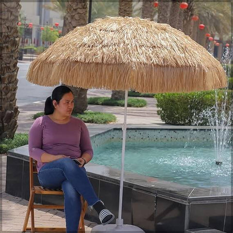 Hawaiian style straw umbrella offering shade for patios