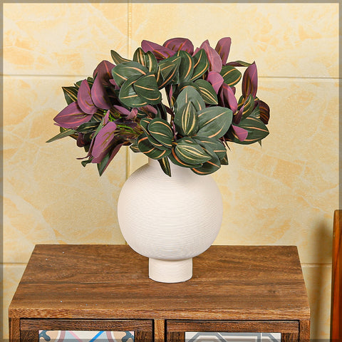 Faux red leaf eyebrow plant for tropical-inspired interiors