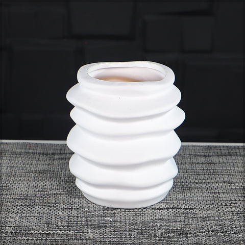 Elegant white ceramic vase with artistic wave design