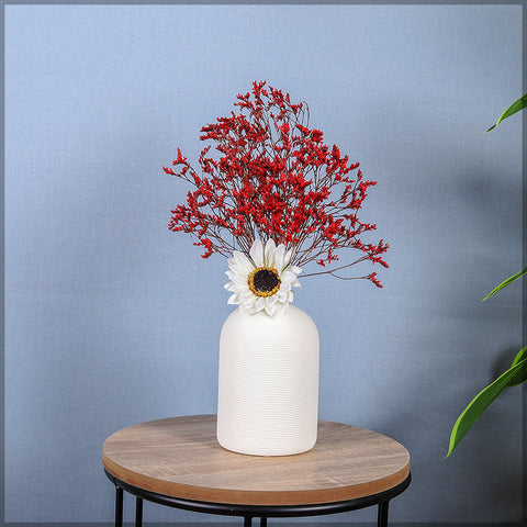 White nordic style ceramic vase placed on a wooden console