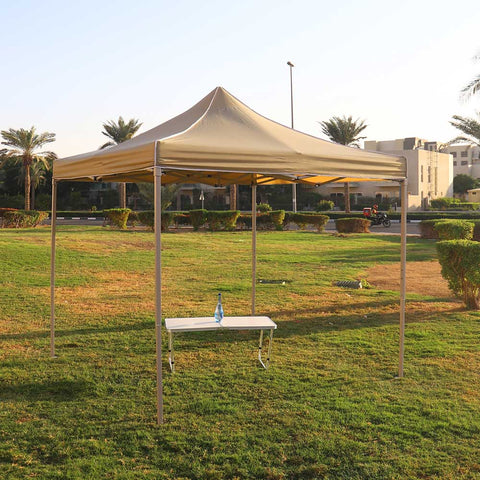 Pop up canopy tent set up for a beach event