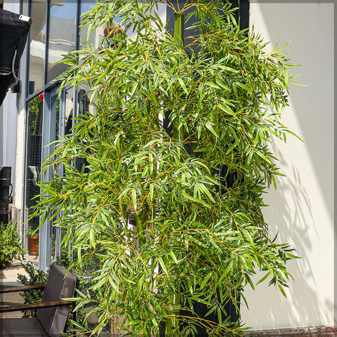 Bamboo fake plants adding greenery and texture to a room