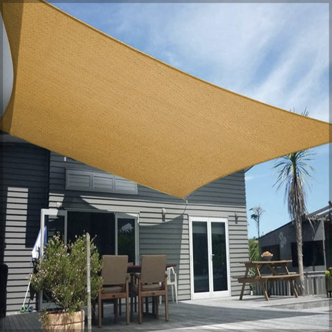 Outdoor sunshade sail set up in a backyard area