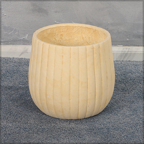 Stylish round concrete planter with ribbed design