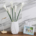 Sleek oval ceramic vase in white for floral arrangements