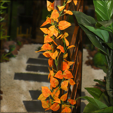 Artificial orange leaves for autumn-inspired arrangements