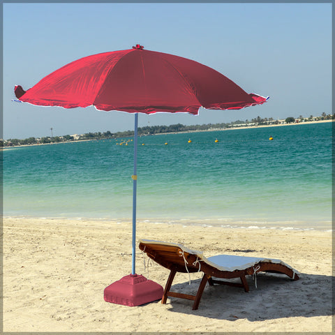 Beach umbrella with base providing shade at the beach