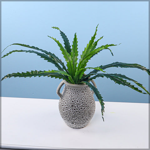 Faux fern leaves for creating tropical indoor plant arrangements