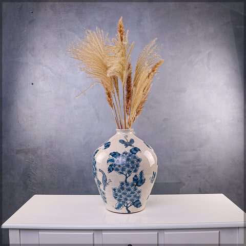 Floral ceramic vase in blue with intricate patterns