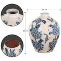 Blue ceramic vase with floral motifs