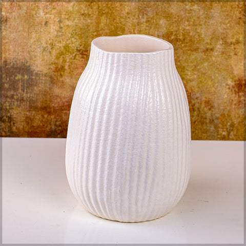 Stylish cream flower vase for decor on a dining table