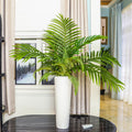 Artificial green palm leaves