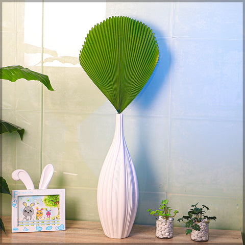 Faux fan palm leaves for room styling