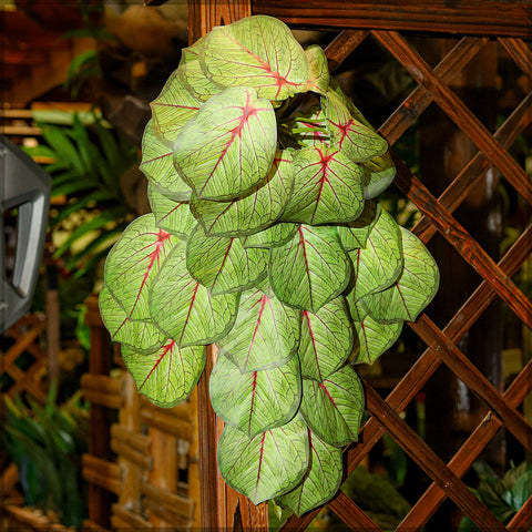 Faux hanging plants with artificial trailing leaves