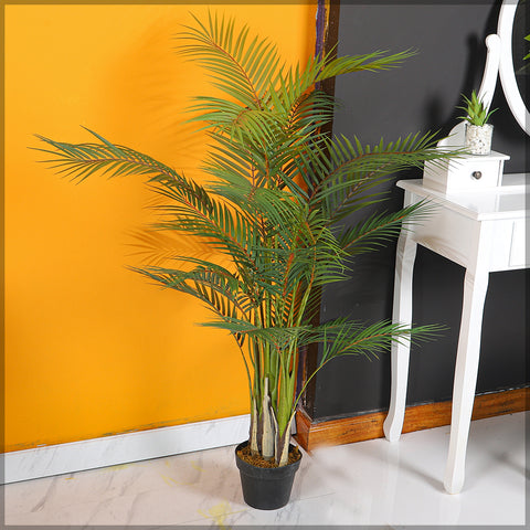 Lifelike artificial areca palm tree enhancing a minimalist home office