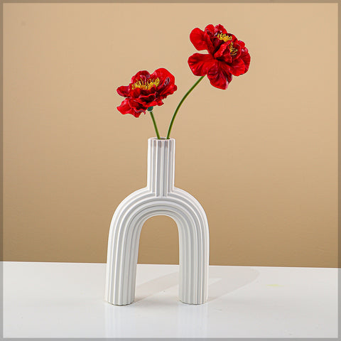 Sleek ceramic table top vase with textured surface