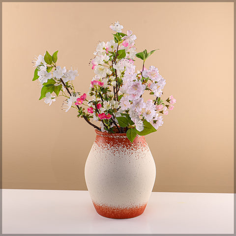 Decorative ceramic vases in orange and white