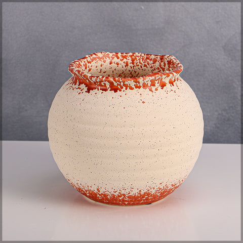 Stylish orange white ceramic planter for contemporary interiors