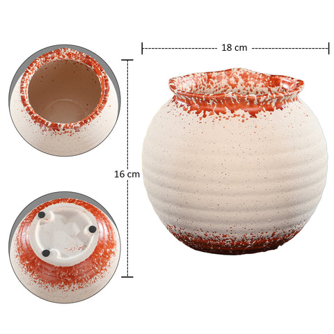 Decorative ceramic flower pot in orange and white for indoor plants