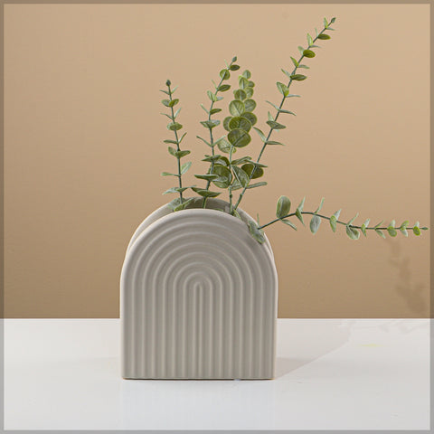 Modern ribbed ceramic vase with arch design