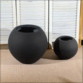 Large black concrete round planter