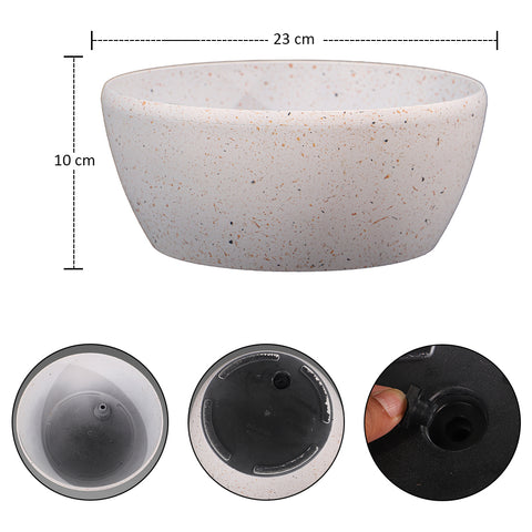 Modern round planter with drainage hole