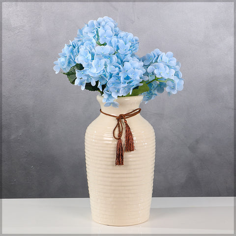 Ceramic vase with ribbon accent for chic home styling