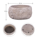 Stylish round cement vase with stone texture on side table