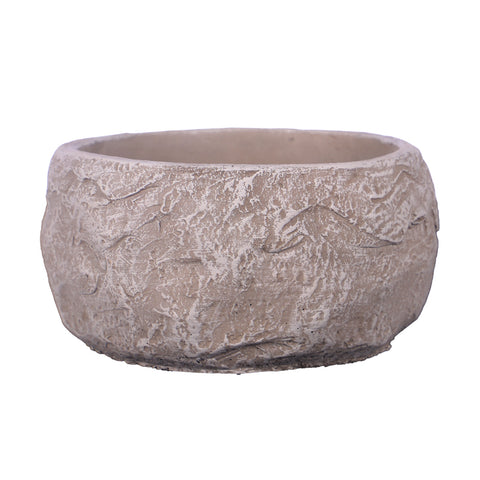 Stone design round cement vase with flowers on a table