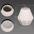 Elegant white ceramic vase with textured finish