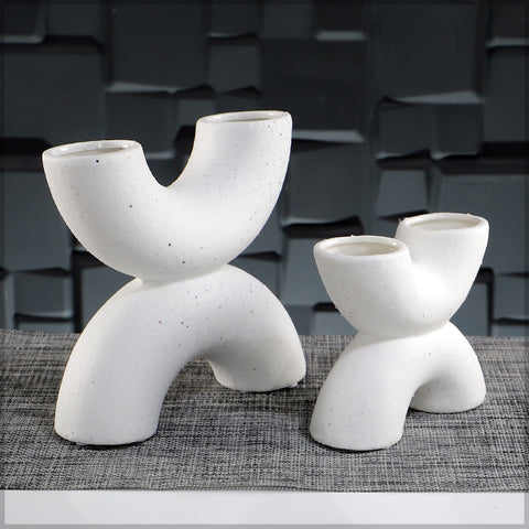 White decorative vases with a semi circle shape