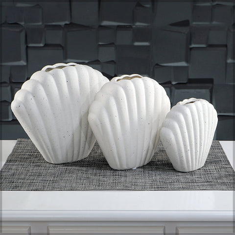 Sculptural white shell vase for beach-inspired decor