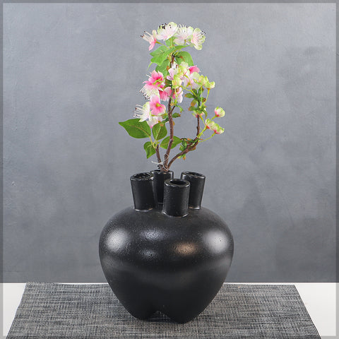 Small black bud vase with elegant round shape