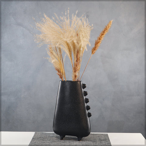 Modern black ceramic vase with sculptural details