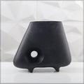 Handmade black ceramic vase with intricate texture