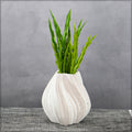 White ceramic vase with geometric pattern