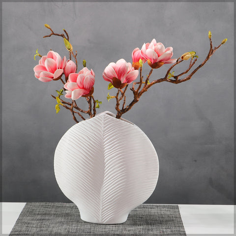 Decorative white vase with a unique leaf texture