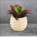 Decorative ceramic vase with wave design for stylish interiors