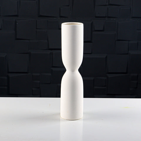 Minimalist ribbed white ceramic vase for floral displays