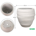 Decorative white concrete ribbed planter