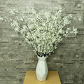 Faux white leaf twig arrangements for floral displays